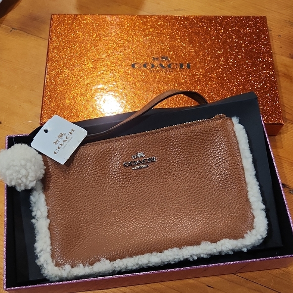 Coach Handbags - Coach Tan Wristlet with White Shearling Accent